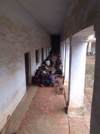 People in corridor of building