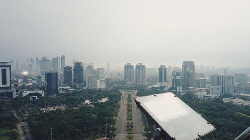 High angle view of buildings in city against clear sky