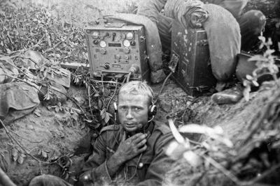 High angle view portrait of two men sitting outdoors