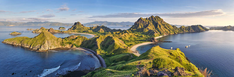 Panoramic view of sea and mountains against sky