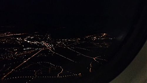 Aerial view of illuminated city at night