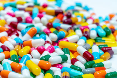 Selective focus on multi-colored antibiotic capsule pills. antibiotic drug resistance concept. 