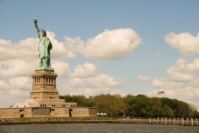 Statue of liberty against cloudy sky