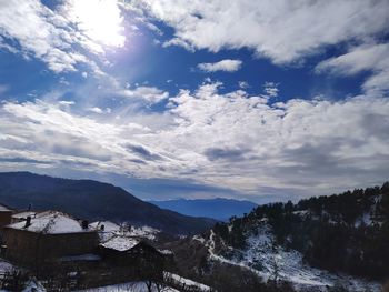 Scenic view of snowcapped mountains against sky