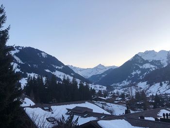 Scenic view of mountains against clear sky during winter