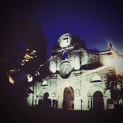 Low angle view of illuminated building at night