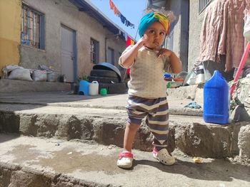 Full length of beautiful girl standing on street