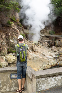 Full length of man standing on rock