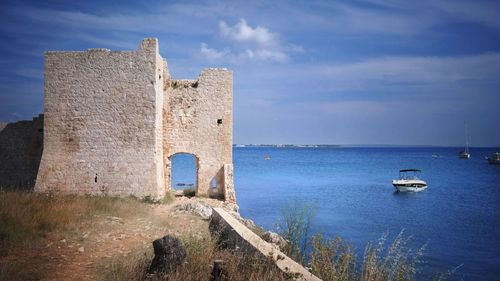 View of fort on sea against sky