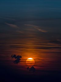 Silhouette trees against sky during sunset