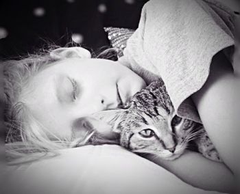 Close-up of a girl sleeping on bed