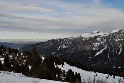 Scenic view of mountains against sky during winter