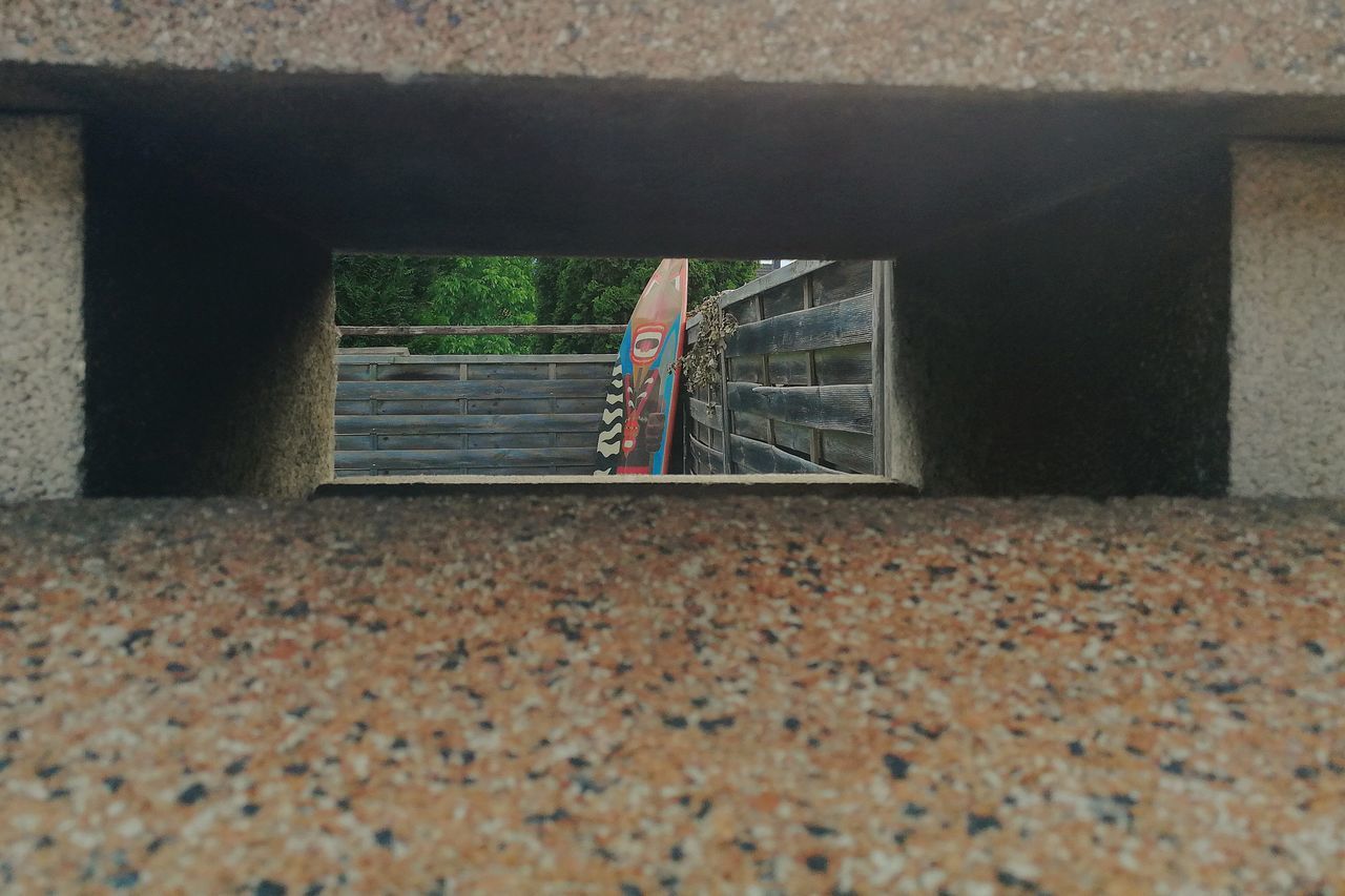 SURFACE LEVEL OF MAN STANDING ON WALL