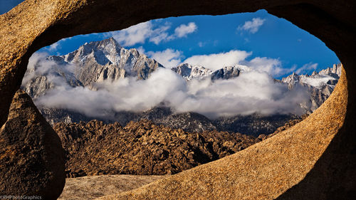 Mt whitney against sky seen through natural arch