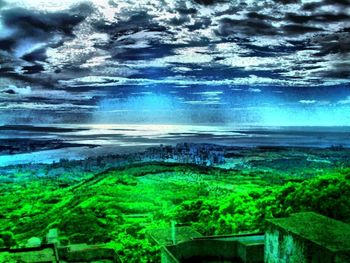 Scenic view of landscape against cloudy sky