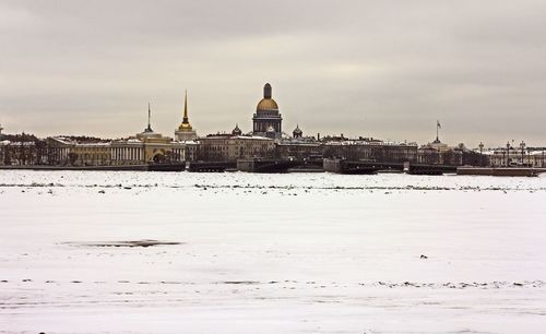 View of mosque against sky during winter