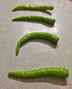 High angle view of green chili pepper on table