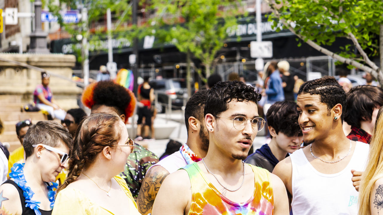 real people, group of people, crowd, large group of people, city, day, lifestyles, women, focus on foreground, street, celebration, men, togetherness, outdoors, architecture, adult, looking, spectator