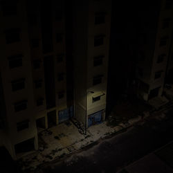 High angle view of street amidst buildings at night