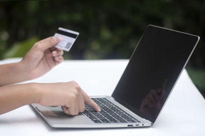 Close-up of hand holding mobile phone
