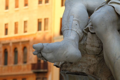 Detail of one foot of the fountain of the four rivers in piazza navona, rome