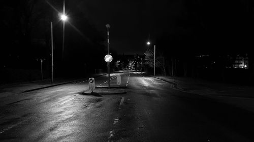 Street lights on road at night