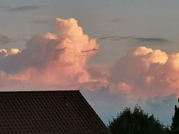 Low angle view of building against sky at sunset