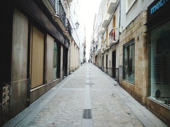 Narrow alley amidst buildings in city