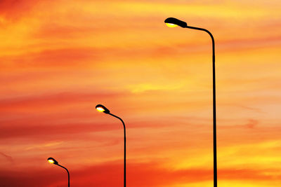 Silhouette street light against sky during sunset