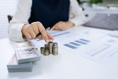 Midsection of businessman working at desk in office