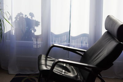 Close-up of chair on table at home