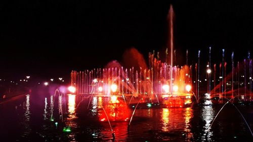 Reflection of illuminated buildings in water