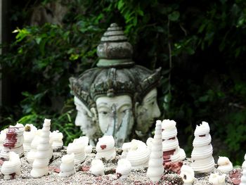 Statue of buddha against trees