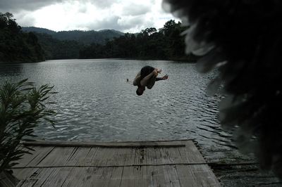 View of lake against cloudy sky