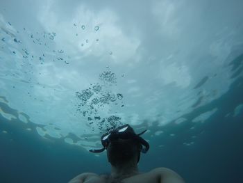 Man swimming in sea