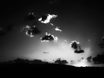 Scenic view of silhouette landscape against sky at sunset