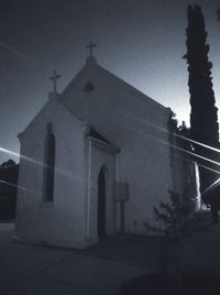 Low angle view of silhouette building against sky at dusk