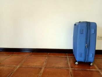 White wall against tiled floor