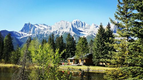 Scenic view of mountains against blue sky