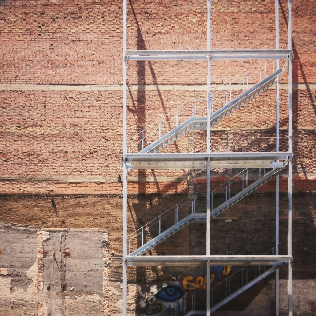 architecture, built structure, building exterior, brick wall, wall - building feature, metal, window, railing, pattern, steps and staircases, staircase, wall, day, steps, outdoors, no people, building, full frame, brick, house