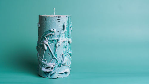 Close-up of blue glass on table