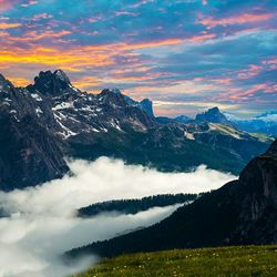 Scenic view of mountains against sky at sunset