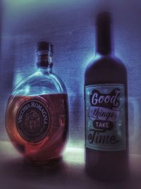 Close-up of wine bottles on table