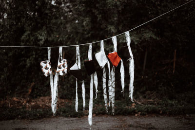 Handmade face masks hanging in a row