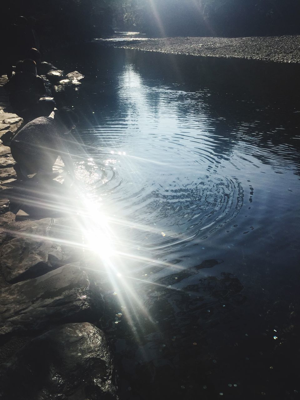 water, reflection, sun, tranquility, sunlight, beauty in nature, tranquil scene, nature, scenics, lake, sunbeam, waterfront, lens flare, idyllic, rippled, outdoors, no people, high angle view, river, shiny