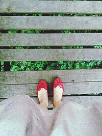 Low section of woman standing on tiled floor