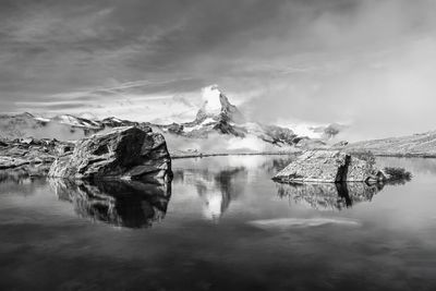 The stellisee lake with a reflection of matterhorn during a morning hike in zermatt, switzerland