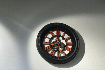 Close-up of clock on wall