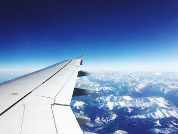 Aerial view of landscape against clear blue sky