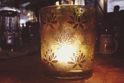 Close-up of candle in darkroom